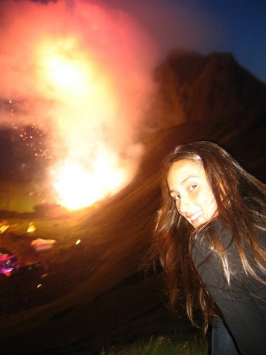 on top of the mountain looking down on the valley, the tiny stage and firework smog