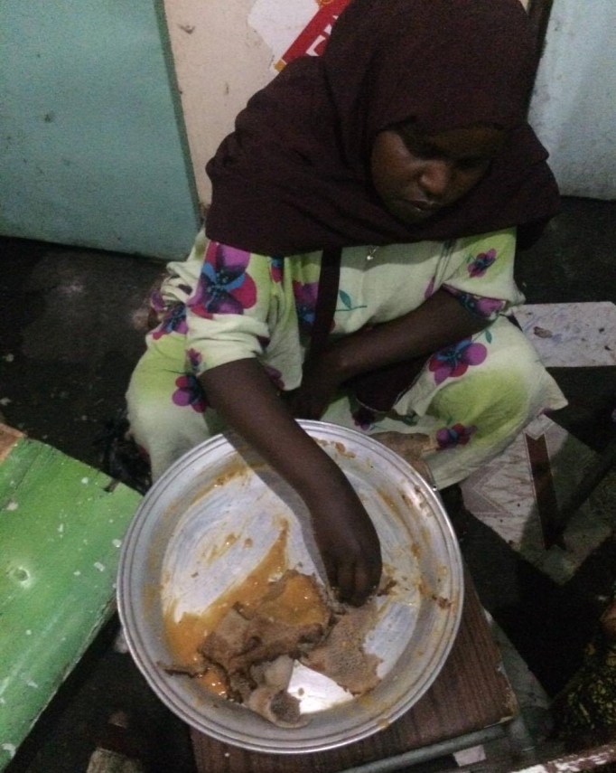 sharing some injera and shiro with our hotel cook