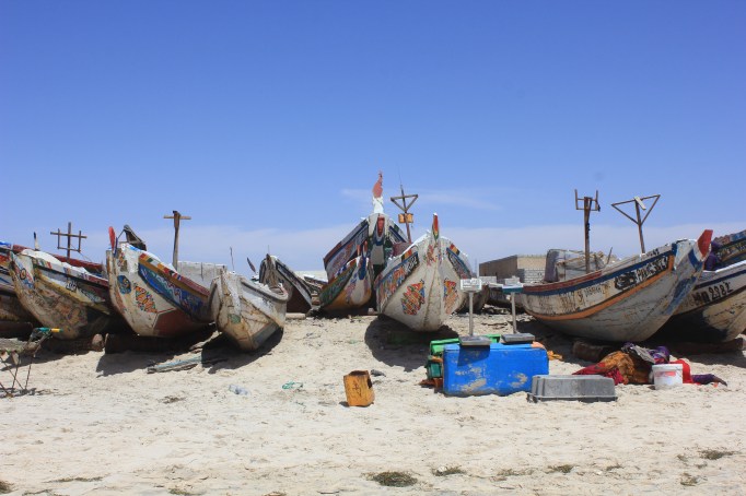 a beach full of boats